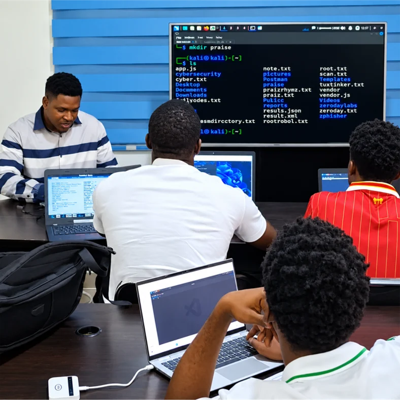 A digital skills class working on laptops